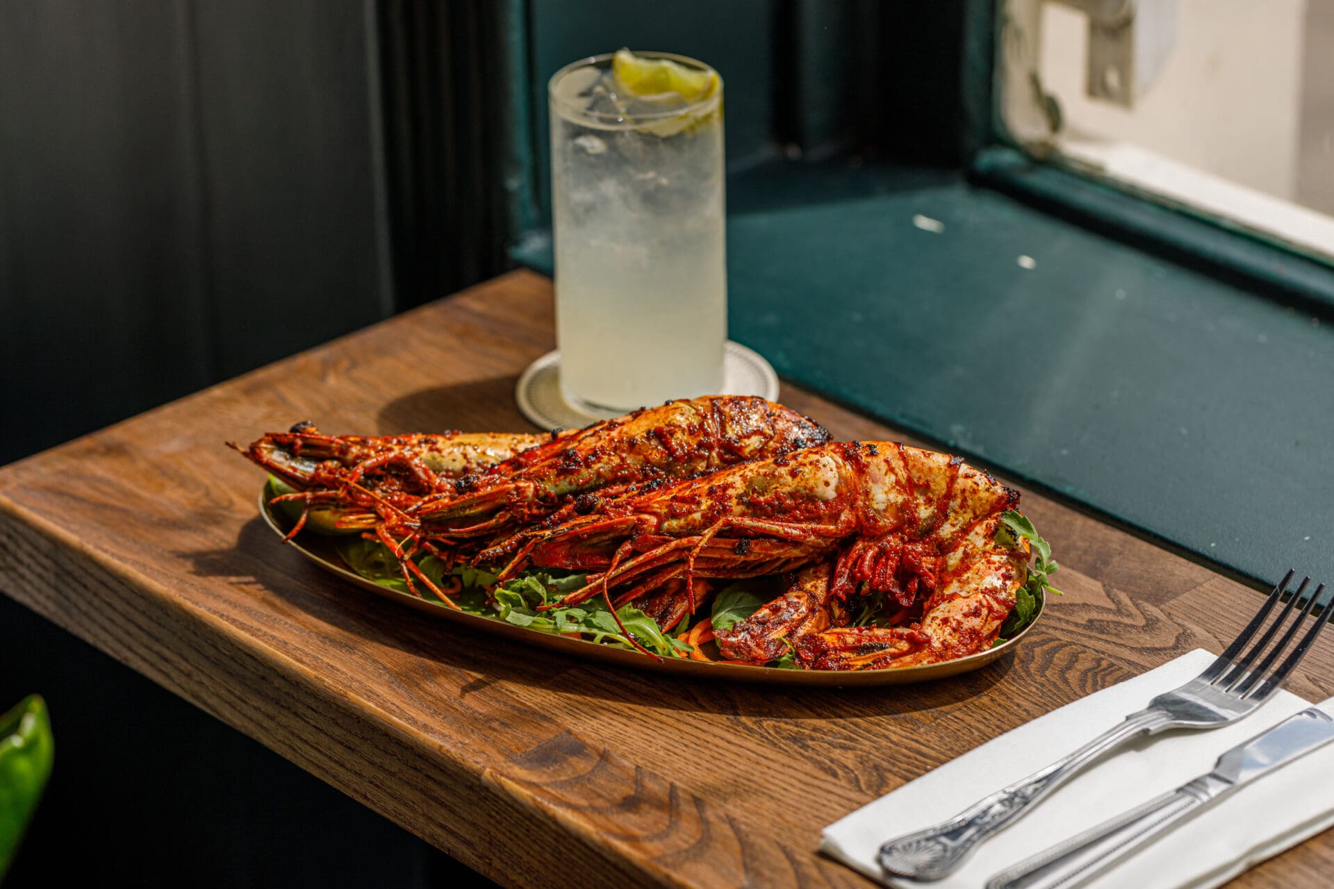 ROADBOOK's guide to the best London restaurants | A metal dish holds three grilled king prawns