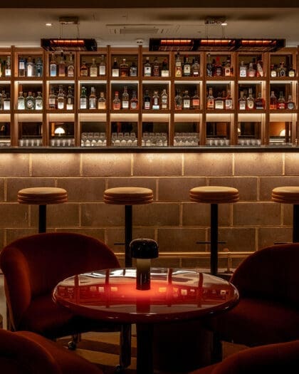 London's best cocktail bars | The bar and stools inside low-lit bar Seed Library inside One Hundred Shoreditch