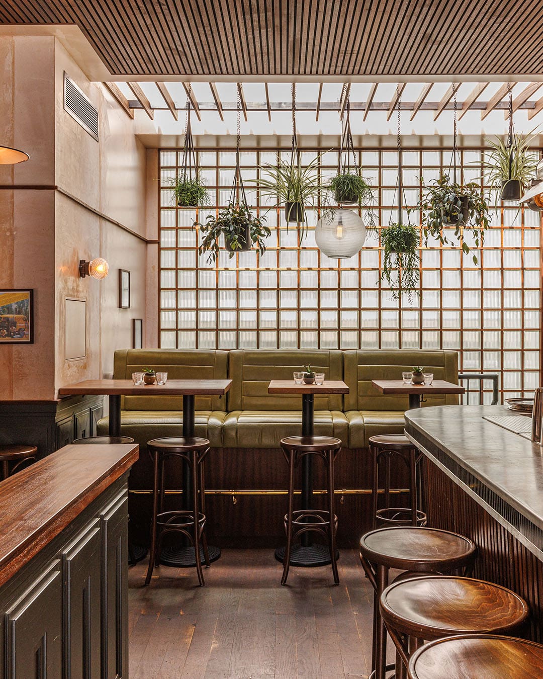 Equal Parts in Hackney, modern wooden bar and tables with hanging plants