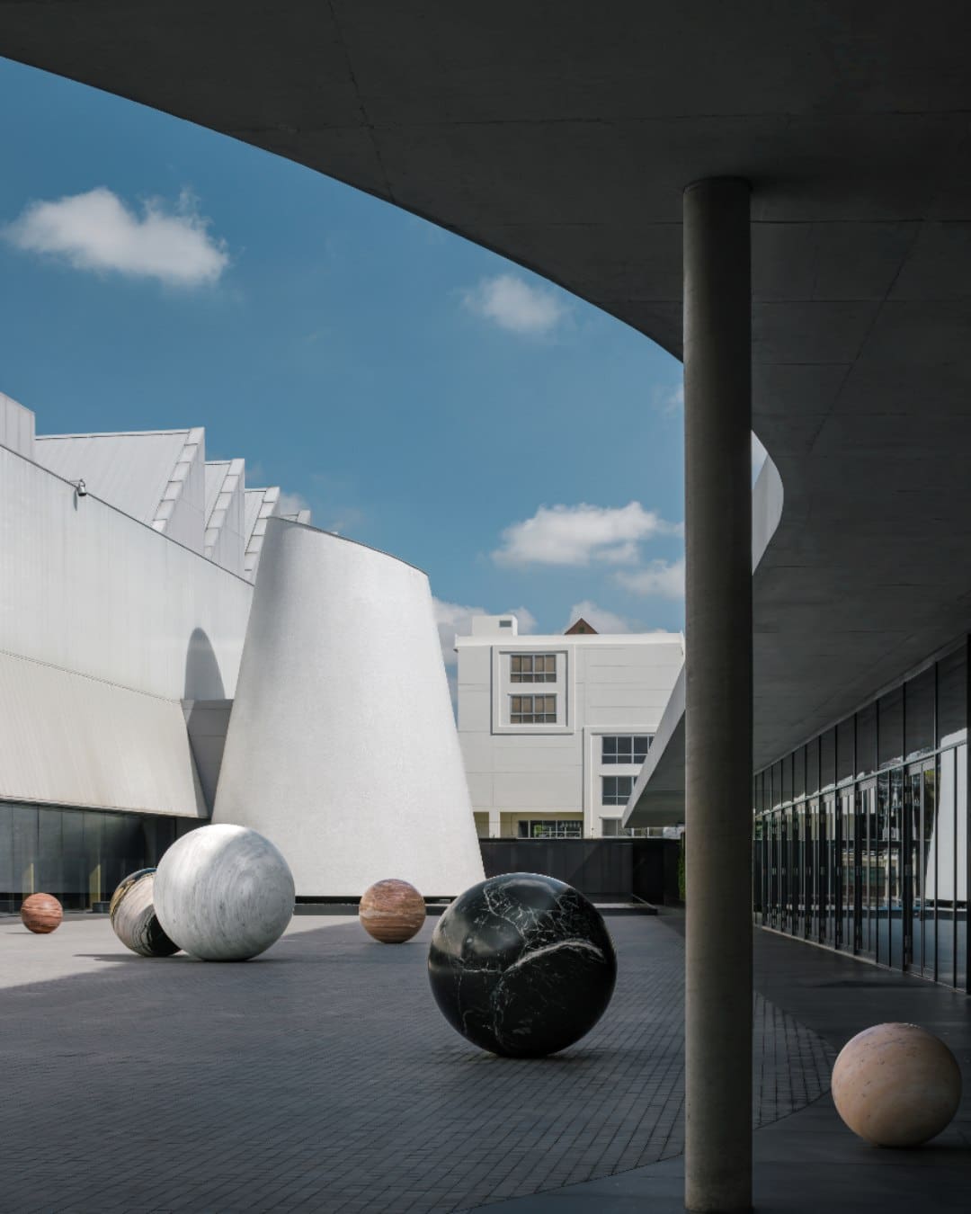 Polish artist Alicja Kwade’s stone globes on display at Dib Bangkok