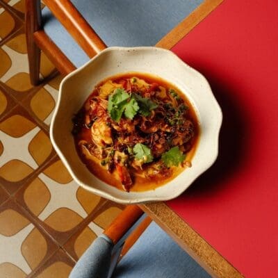 Modern Thai against a retro tiled floor at Charmkrung restaurant in Bangkok