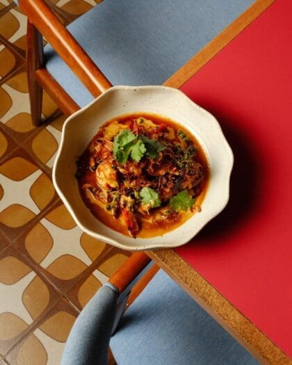 Modern Thai against a retro tiled floor at Charmkrung restaurant in Bangkok