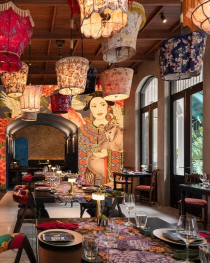 The mural covered wall at GOAT restaurant in Bangkok