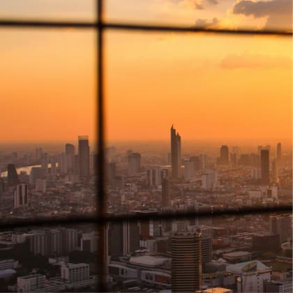 Bangkok's dazzling skyline pictured against a blood-orange sunset