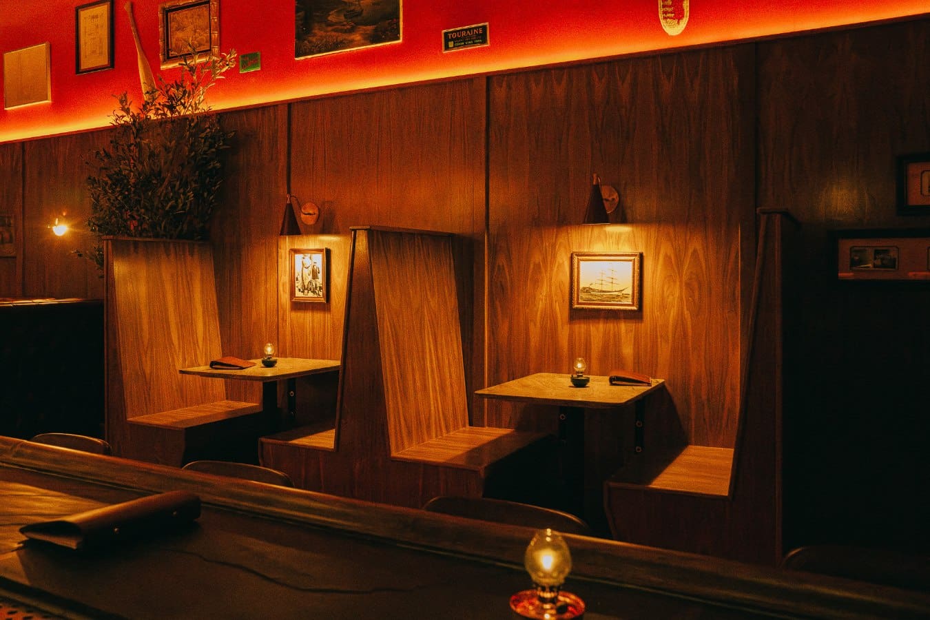 A low-lit booth at Real Charmer