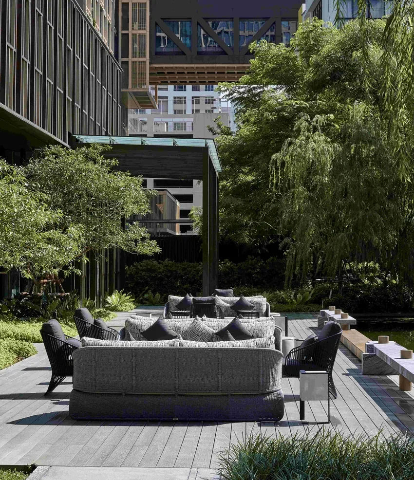 The best hotels in Bangkok | outdoor seating in a garden setting at Kimpton Maa-Lai Bangkok