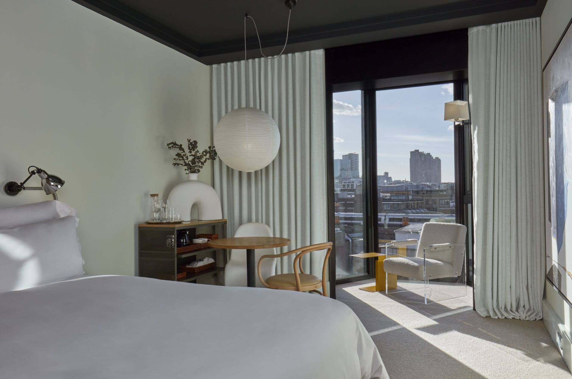 Where to stay in London | a sleek, modern, white room at new hotel One Hundred Shoreditch