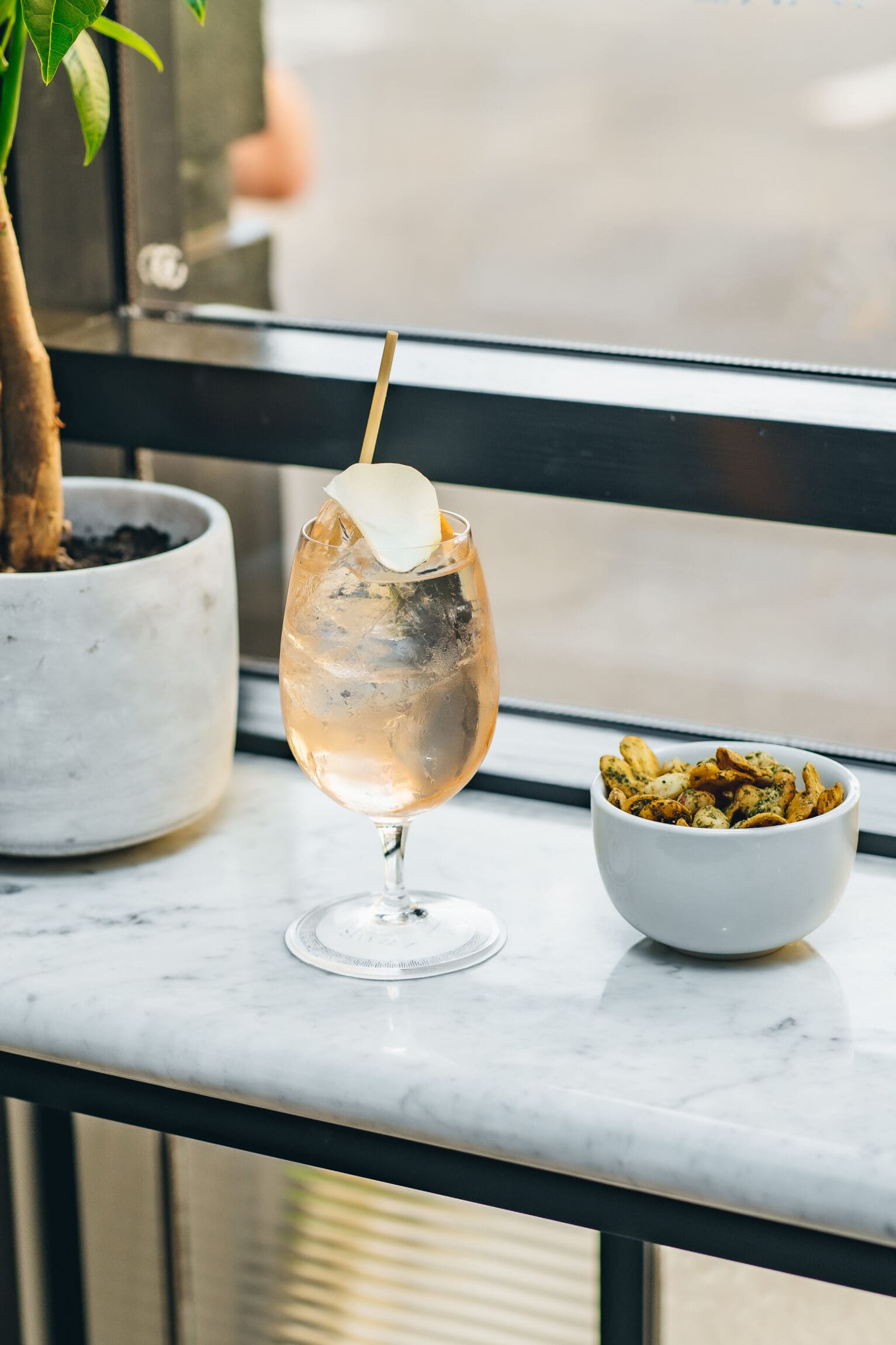 London's best cocktail bars | A cocktail served at a window seat in Swift Shoreditch