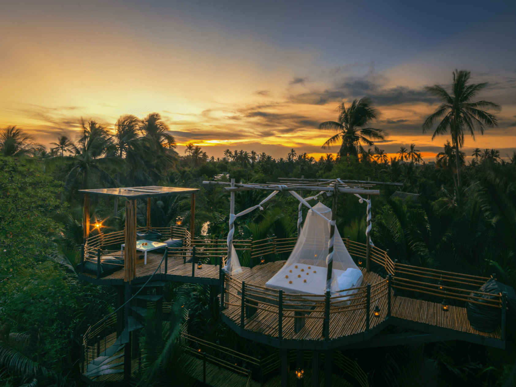 Where to stay in Bangkok | dawn breaks over the forest and an open-air sleeping platform at Bangkok Treehouse