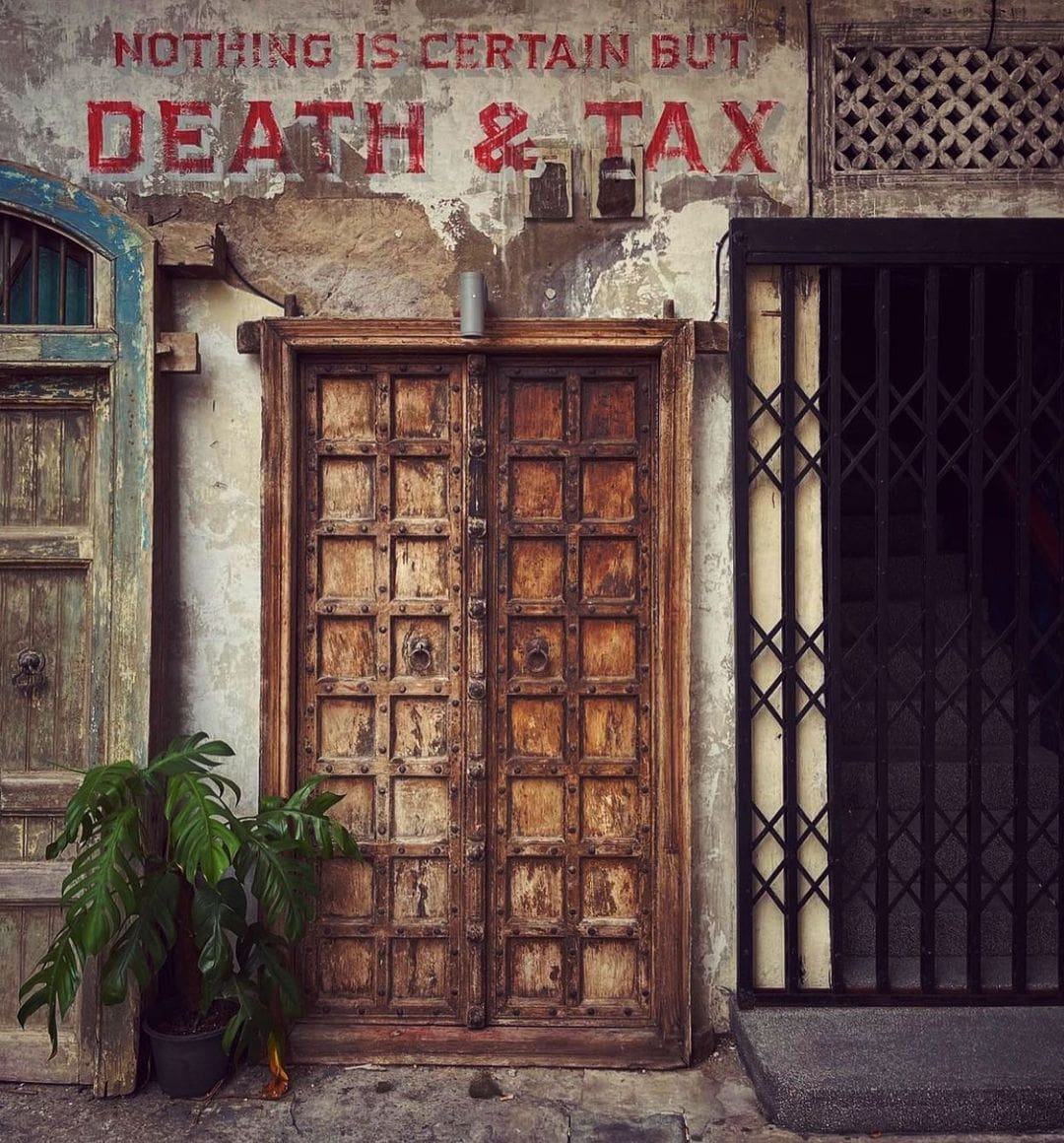 The best bars in Bangkok | the exterior of Tax Bar with eye-catching typography