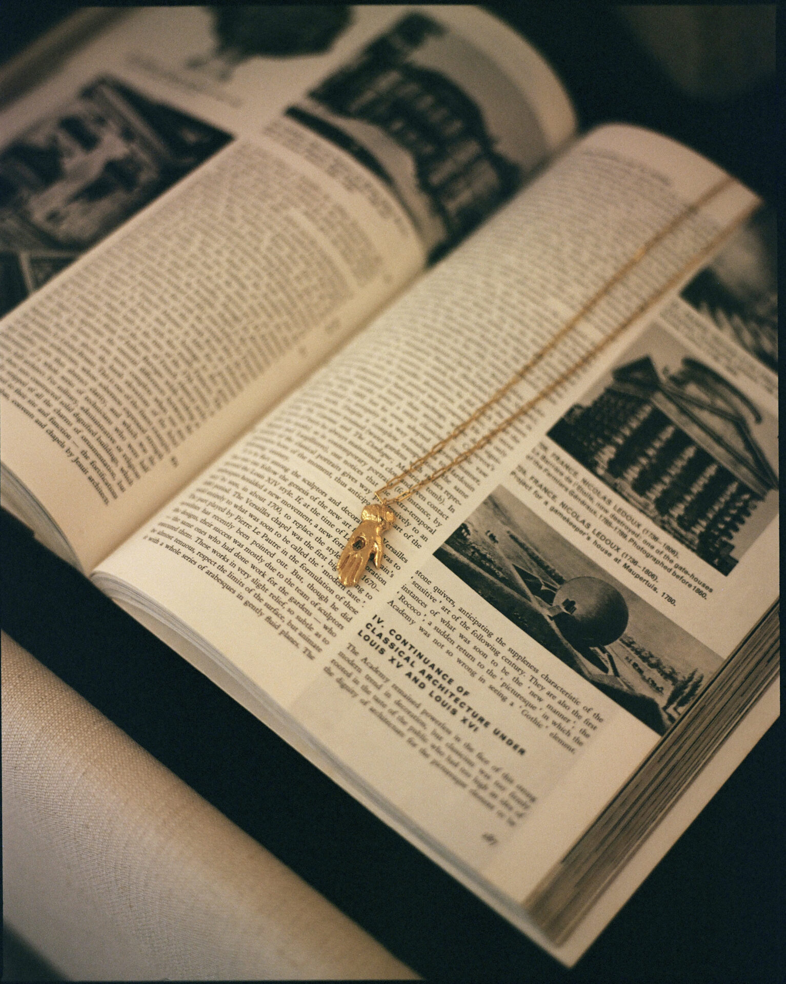 Rosh Mahtani | an Alighieri necklace displayed on a book