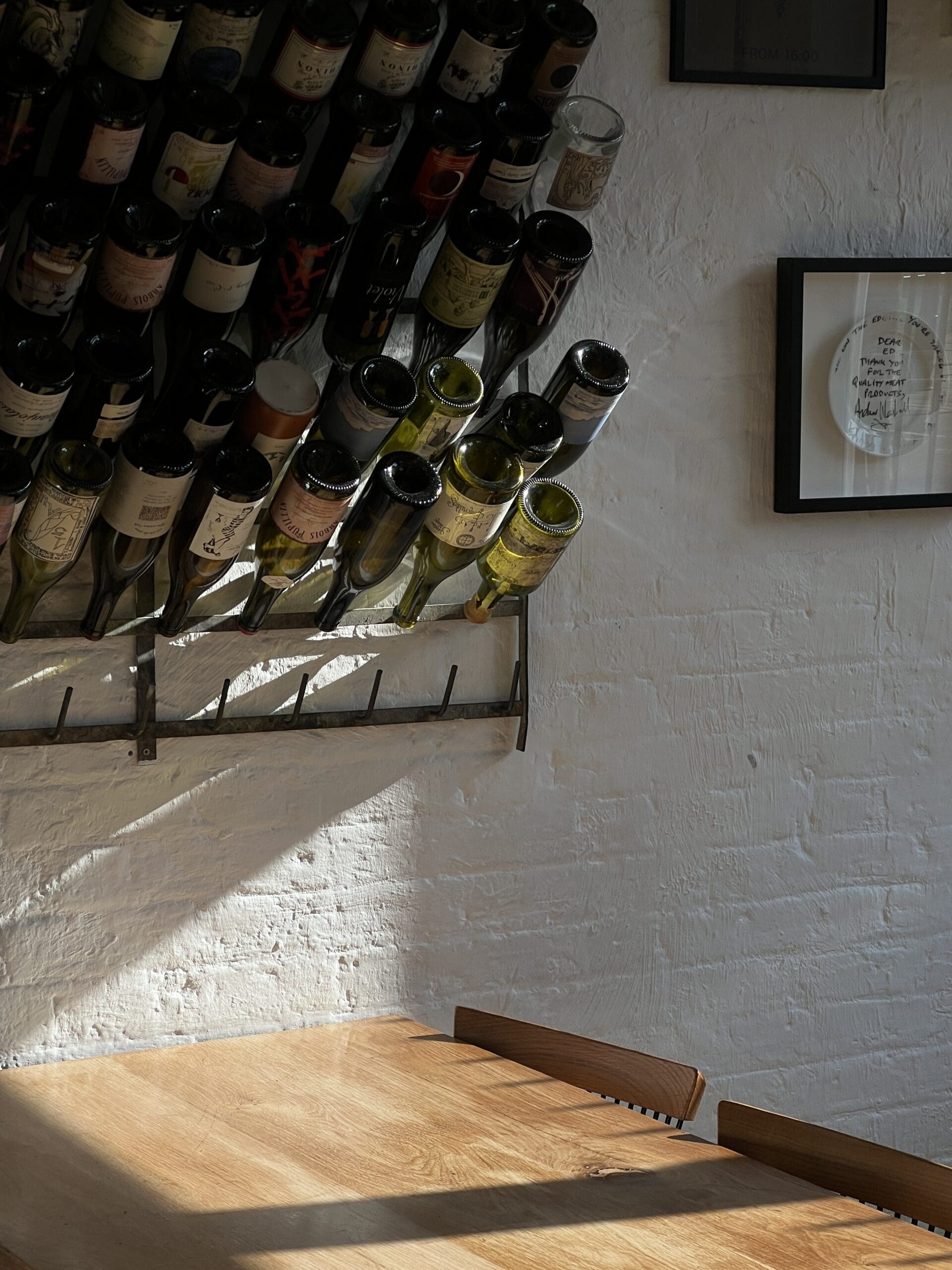 Bottles above a table at Brawn restaurant in Hackney