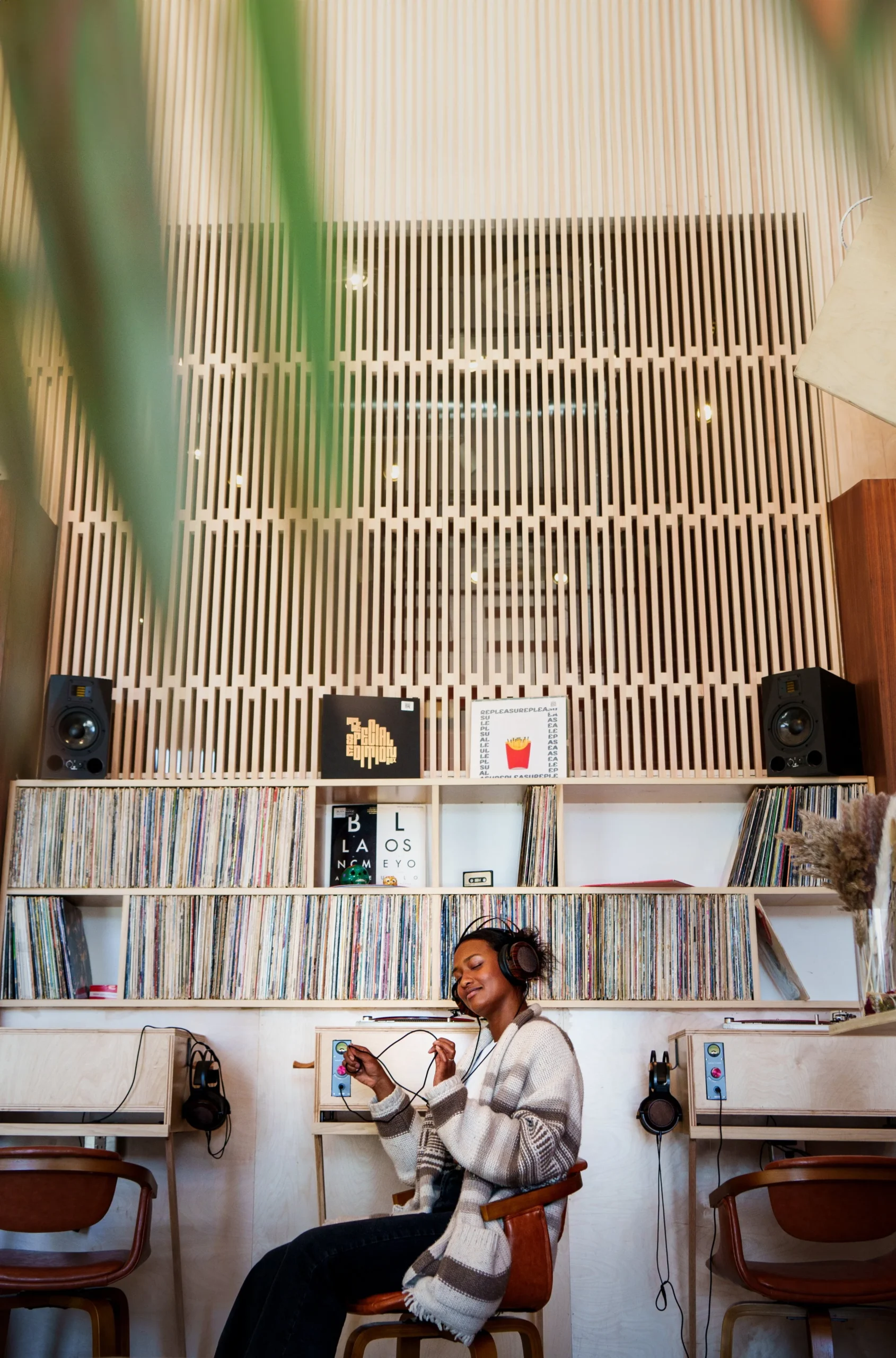 A woman listening to vinyl at Established coffee shop in LA