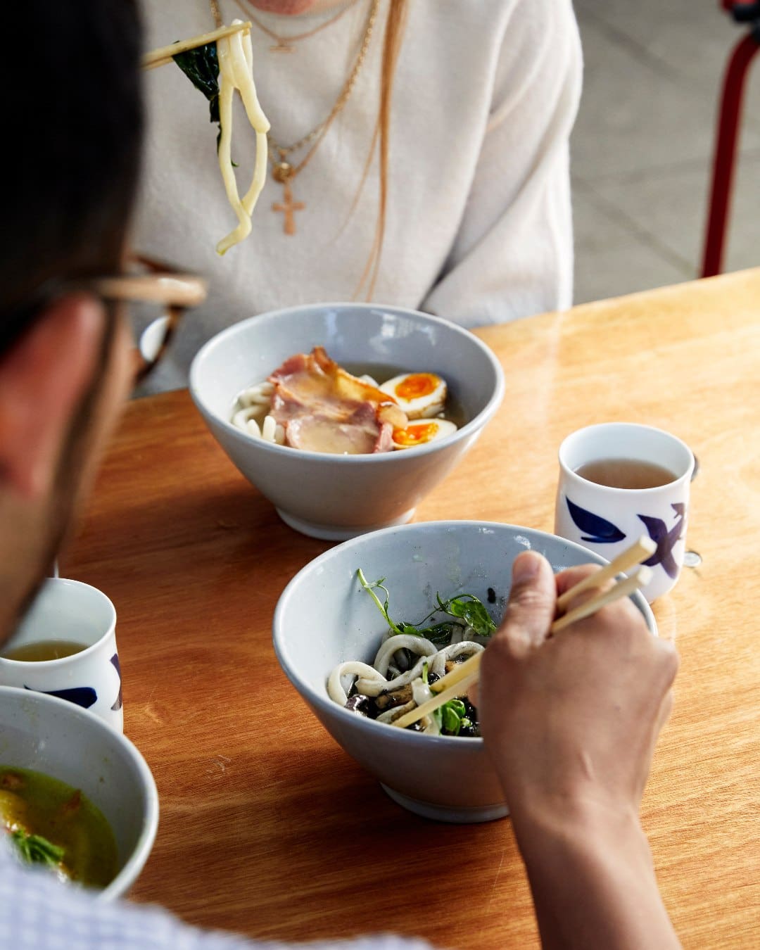 Two people eating noodles at Koya Ko in Hackney