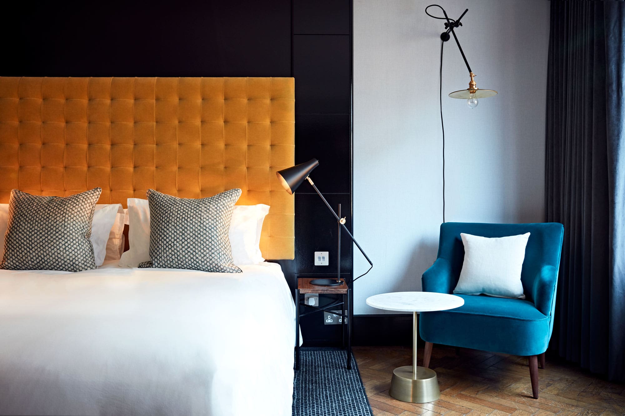 The best hotels in Shoreditch | The Hoxton, with a bed and chair in view