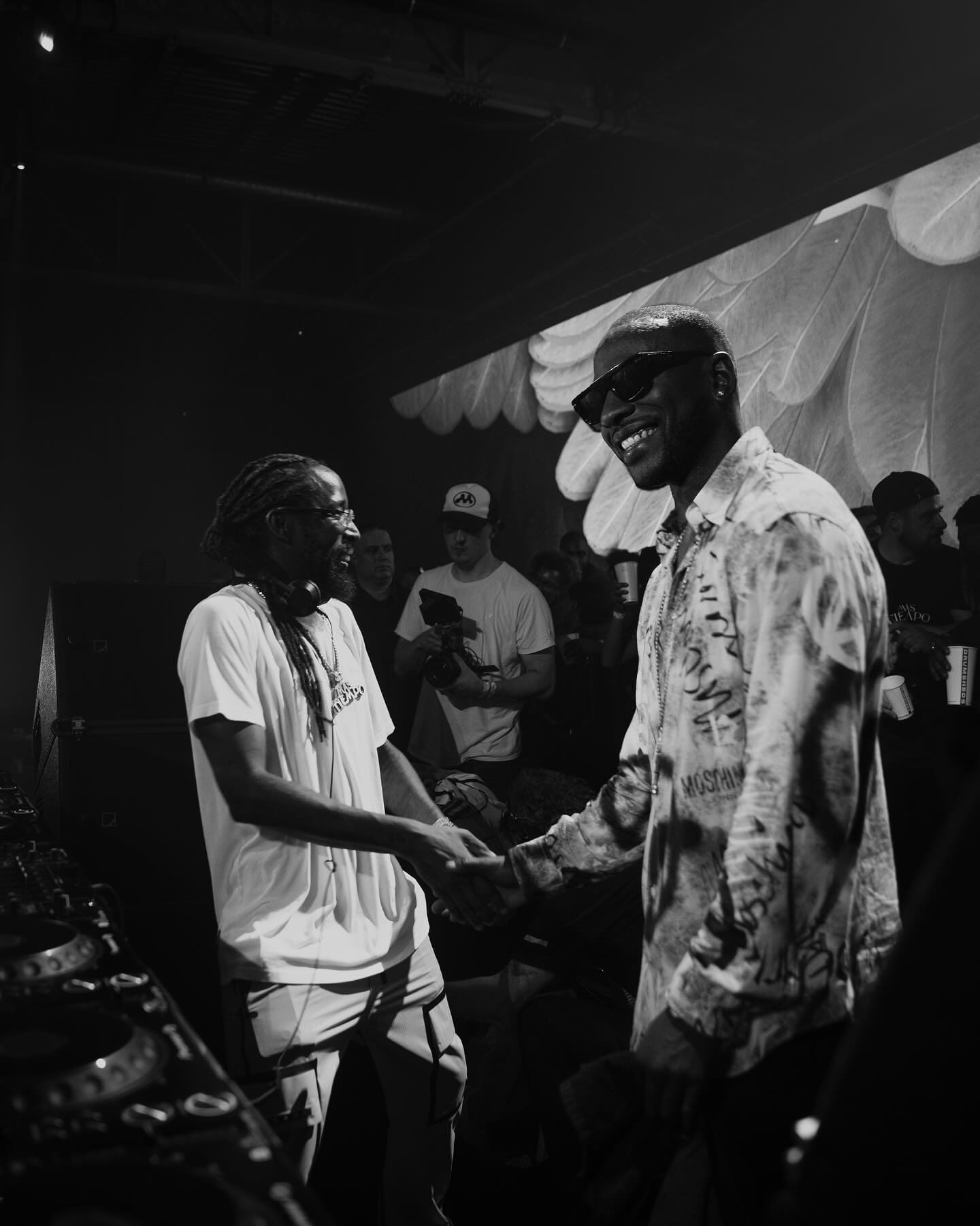 Artists shaking hands at Big Smoke Festival
