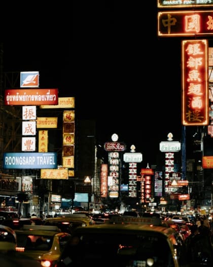 Bangkok at night, lit up by neon signs, photography by Tarun Ottur