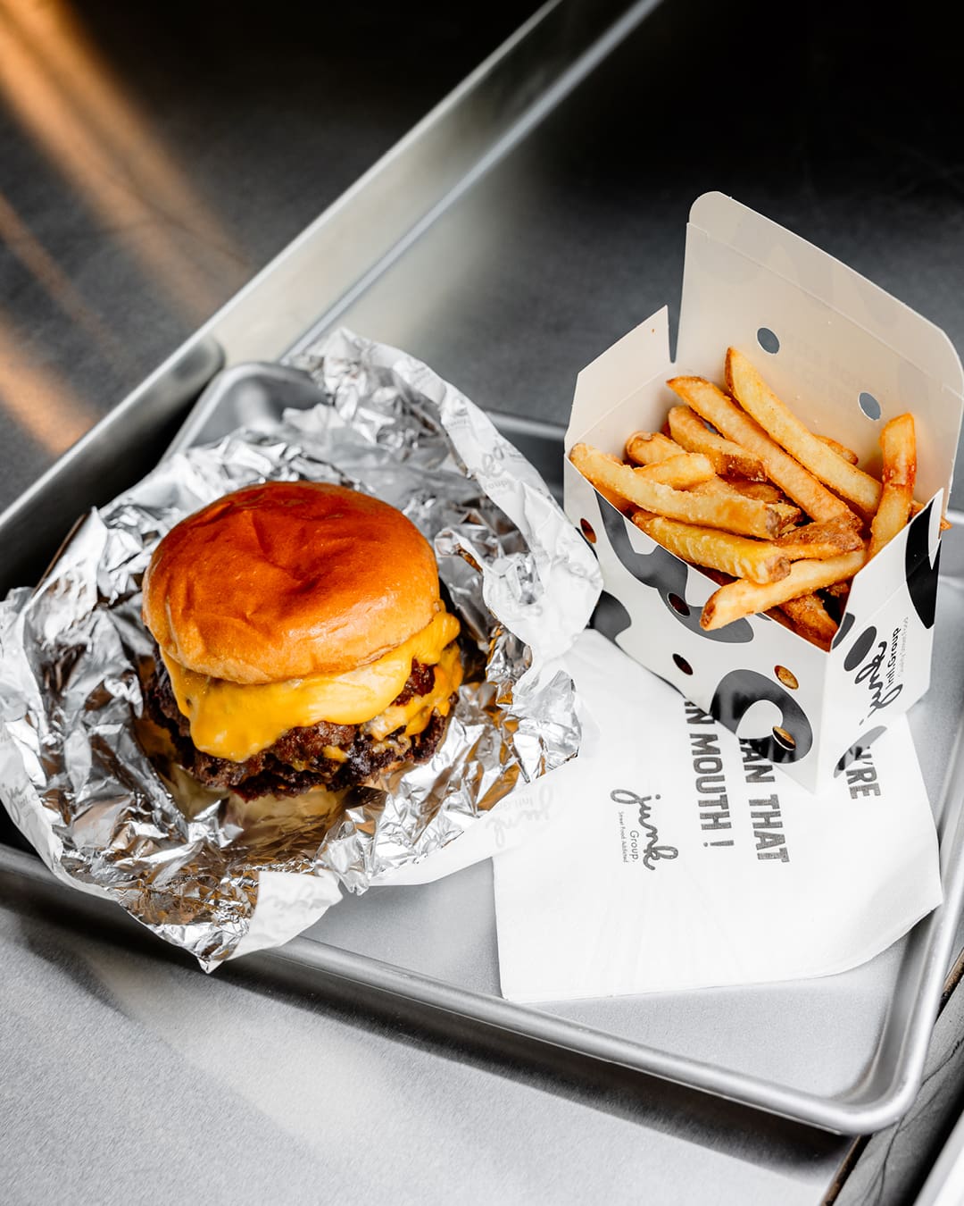 Loaded smashburgers and fries at Junk in Soho