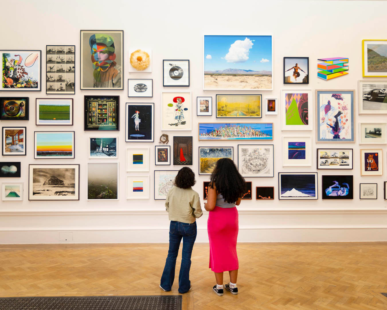 A myriad of colourful artworks frame the walls at the Royal Academy's 2024 Summer Exhibition