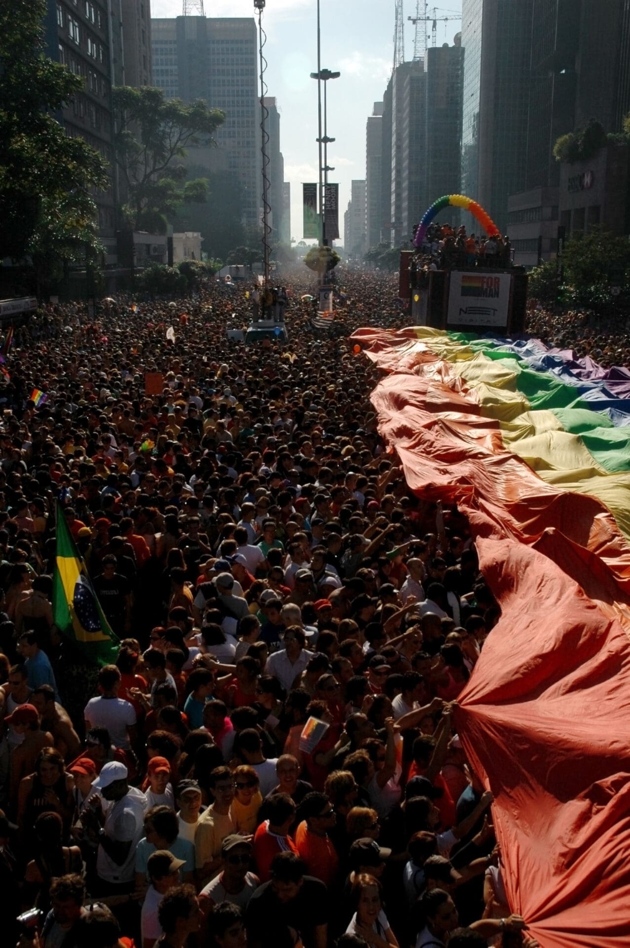 Where and how to celebrate Pride Month around the world | Crowds march and wave the Pride flag along the Avenida Paulista in São Paulo.