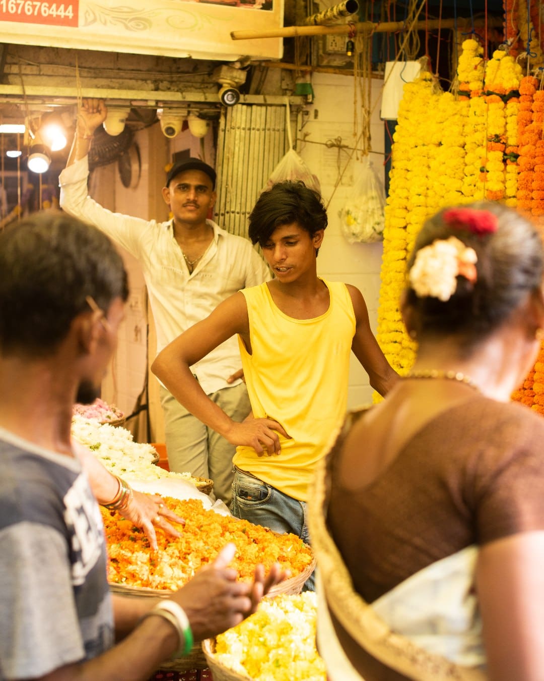 A male vendor selling floral garlands at Diwali in Mumbai
