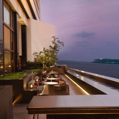 A hotel bar exterior overlooking the river in Mumbai