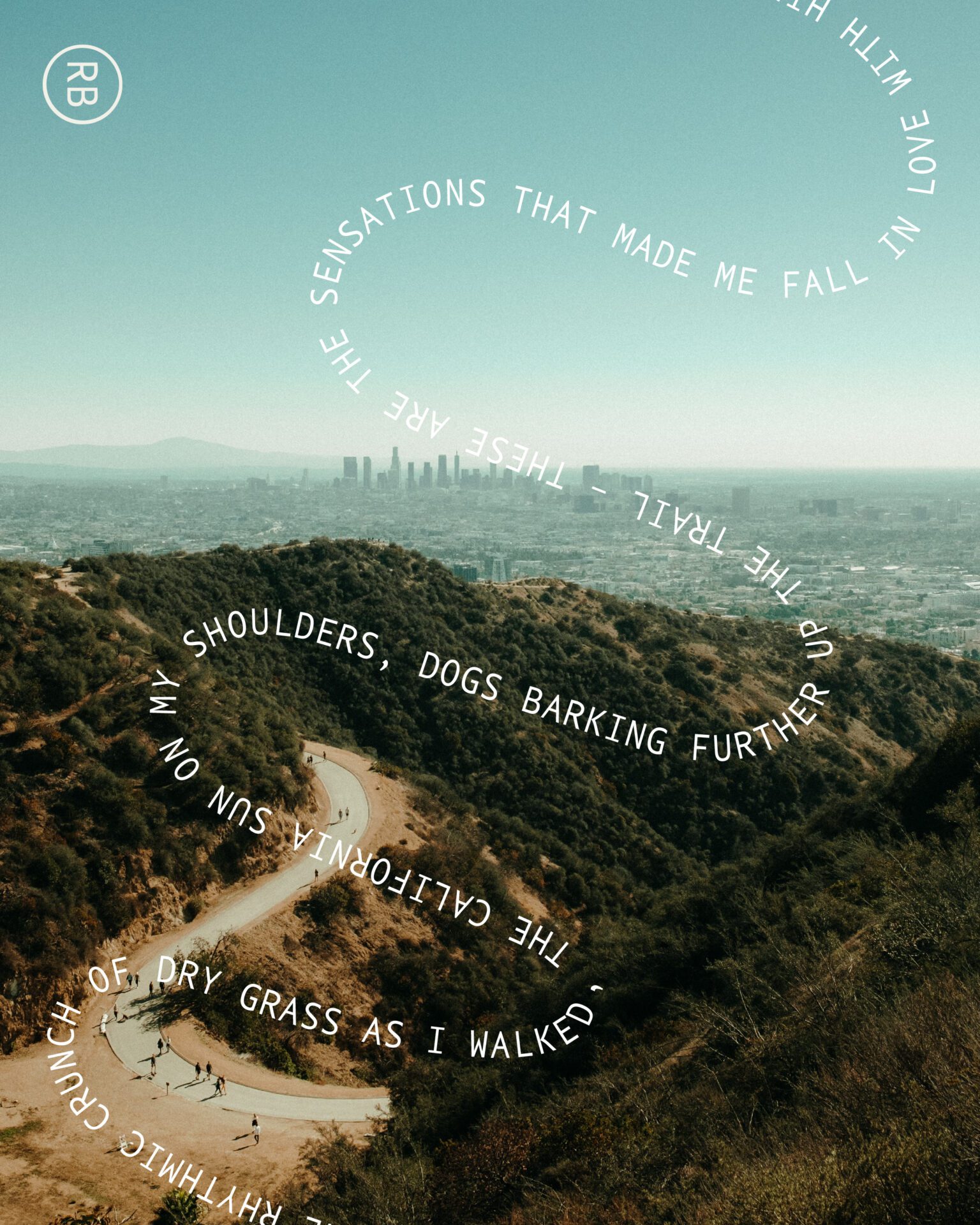 Hiking in LA | a road through the hills outside LA on a sunny day, with a view over the city in the distance