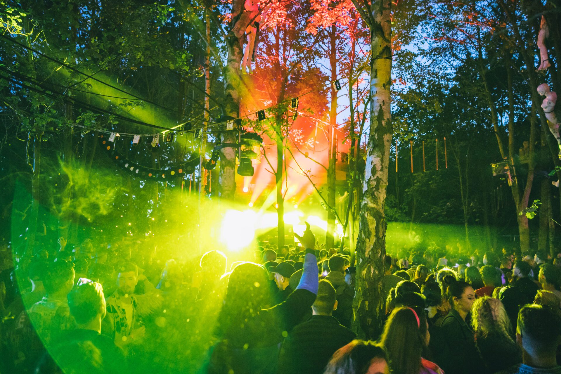 Best European festivals 2022 | A green light shines through the crowd at Lost Village festival