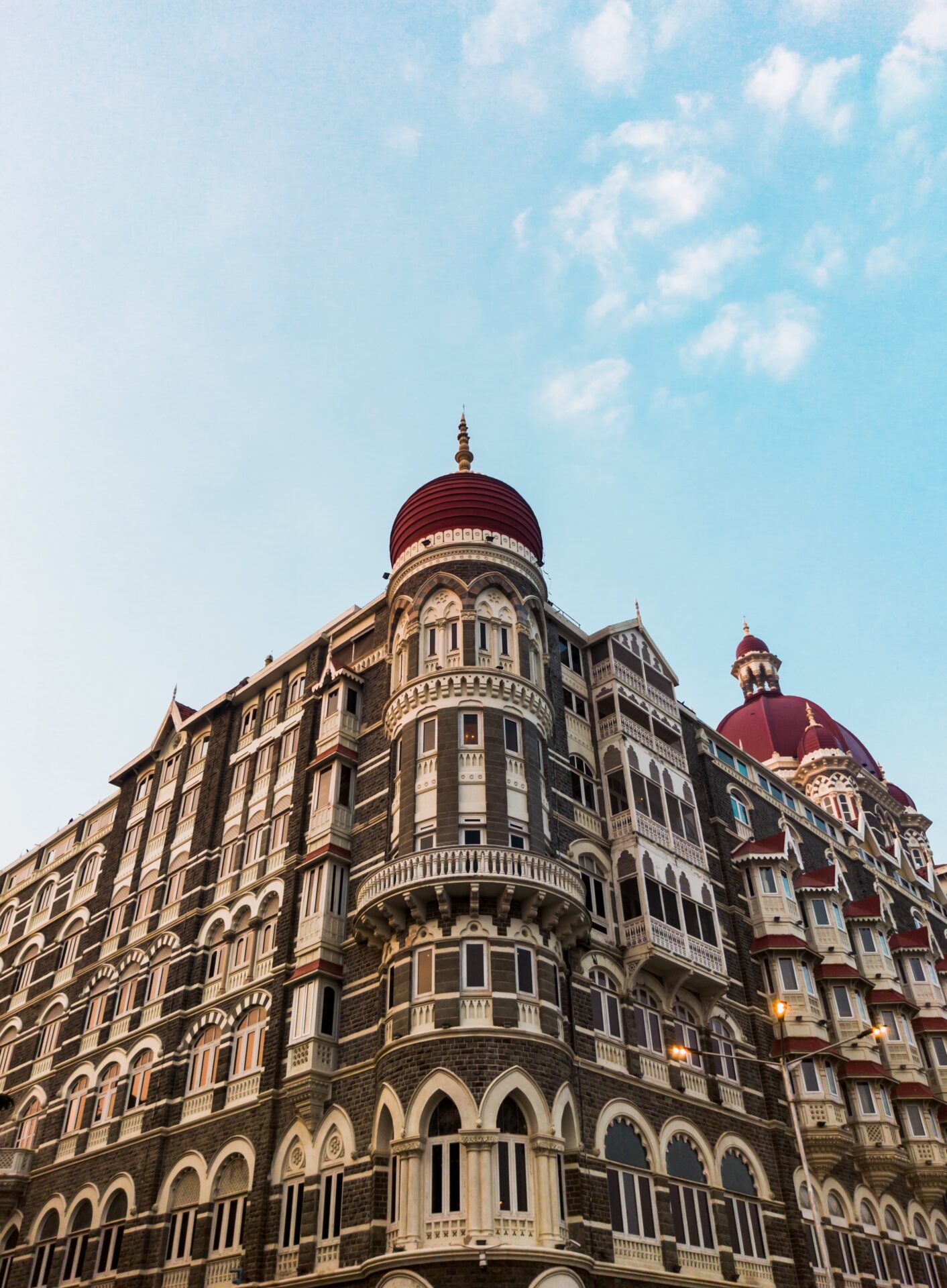 Insider Guide to Mumbai | One of Mumbai's beautiful buildings against a blue sky