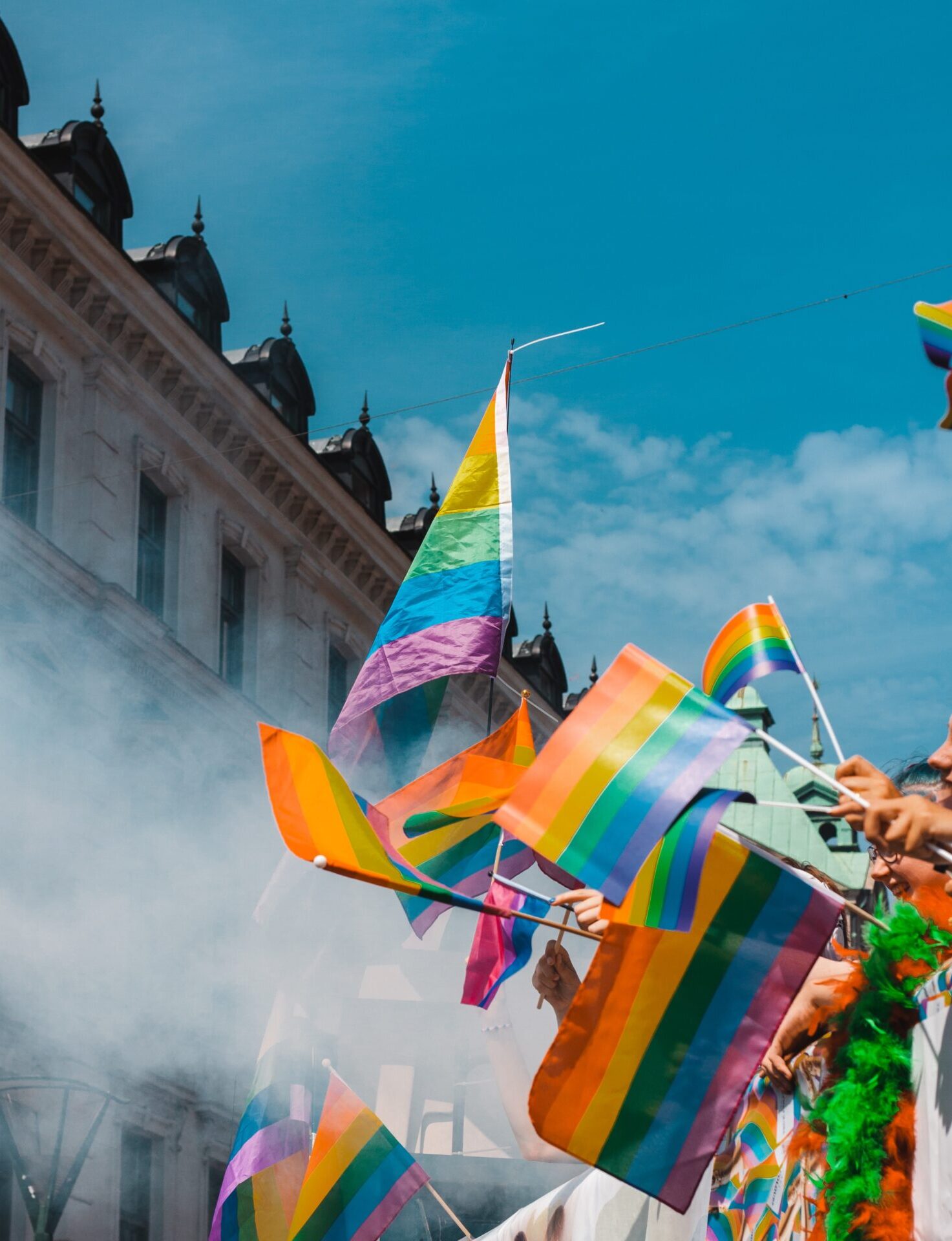 Where and how to celebrate Pride Month around the world | crowds wave the Pride flag