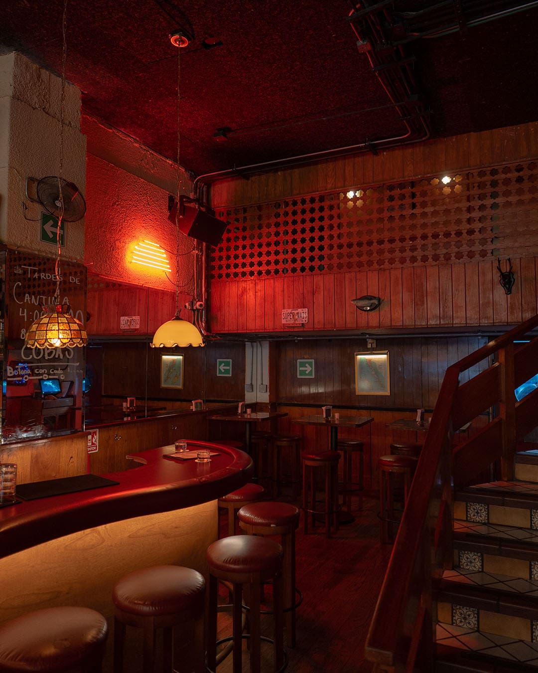 Dive bar energy at Cananea in Mexico City, bathed in a red glow