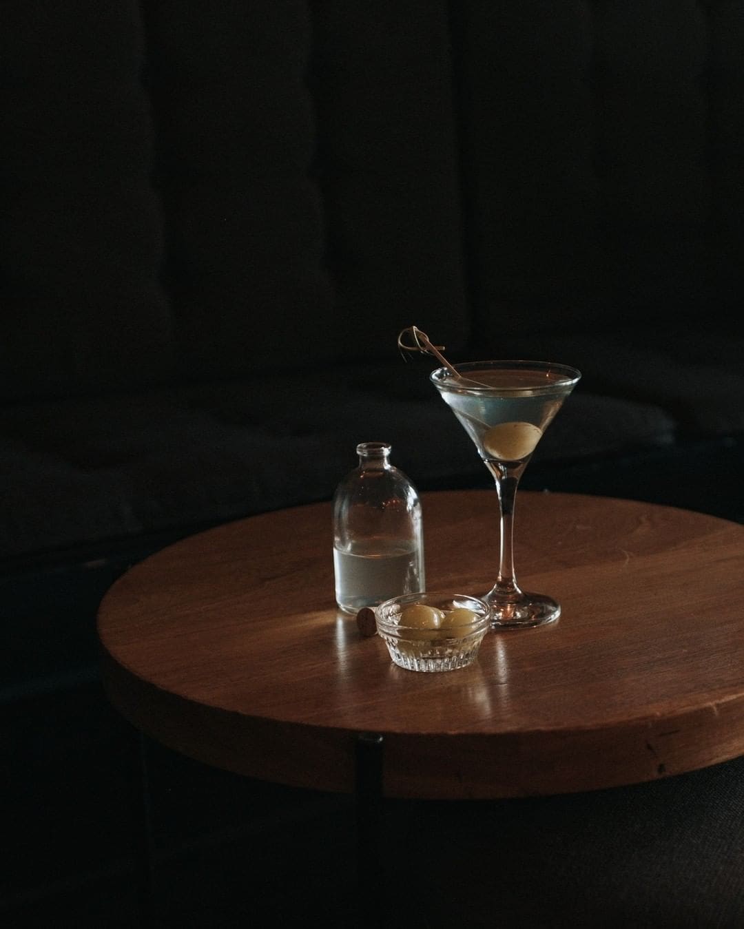 Best bars in Mexico City | A martini served with a small jar of olives at Bar Baltra