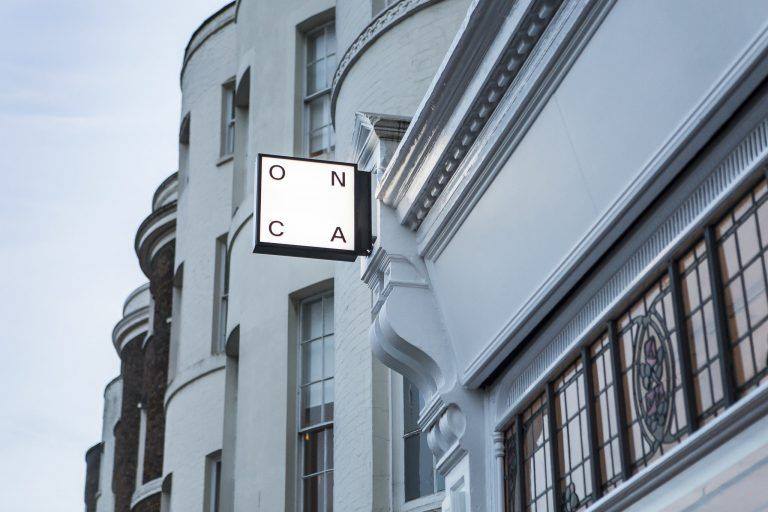 Best galleries in Brighton | A lit sign outside Onca gallery