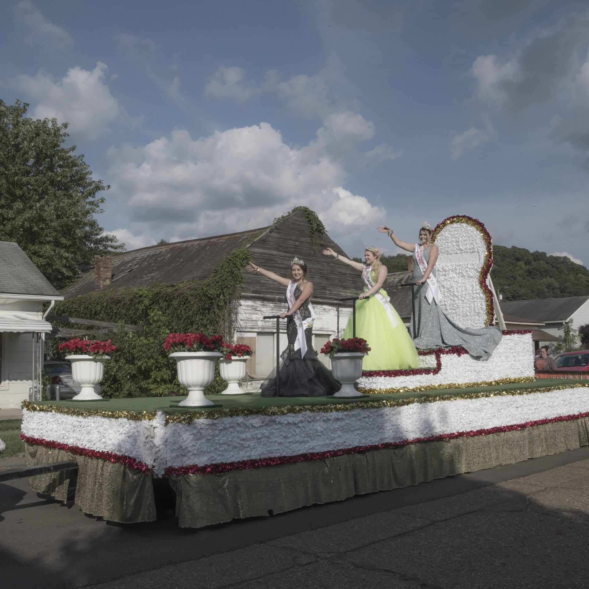 Photographer Rich-Joseph Facun | A beauty pageant in Nelsonville, with a float topped by three beauty queens waving to the crowd