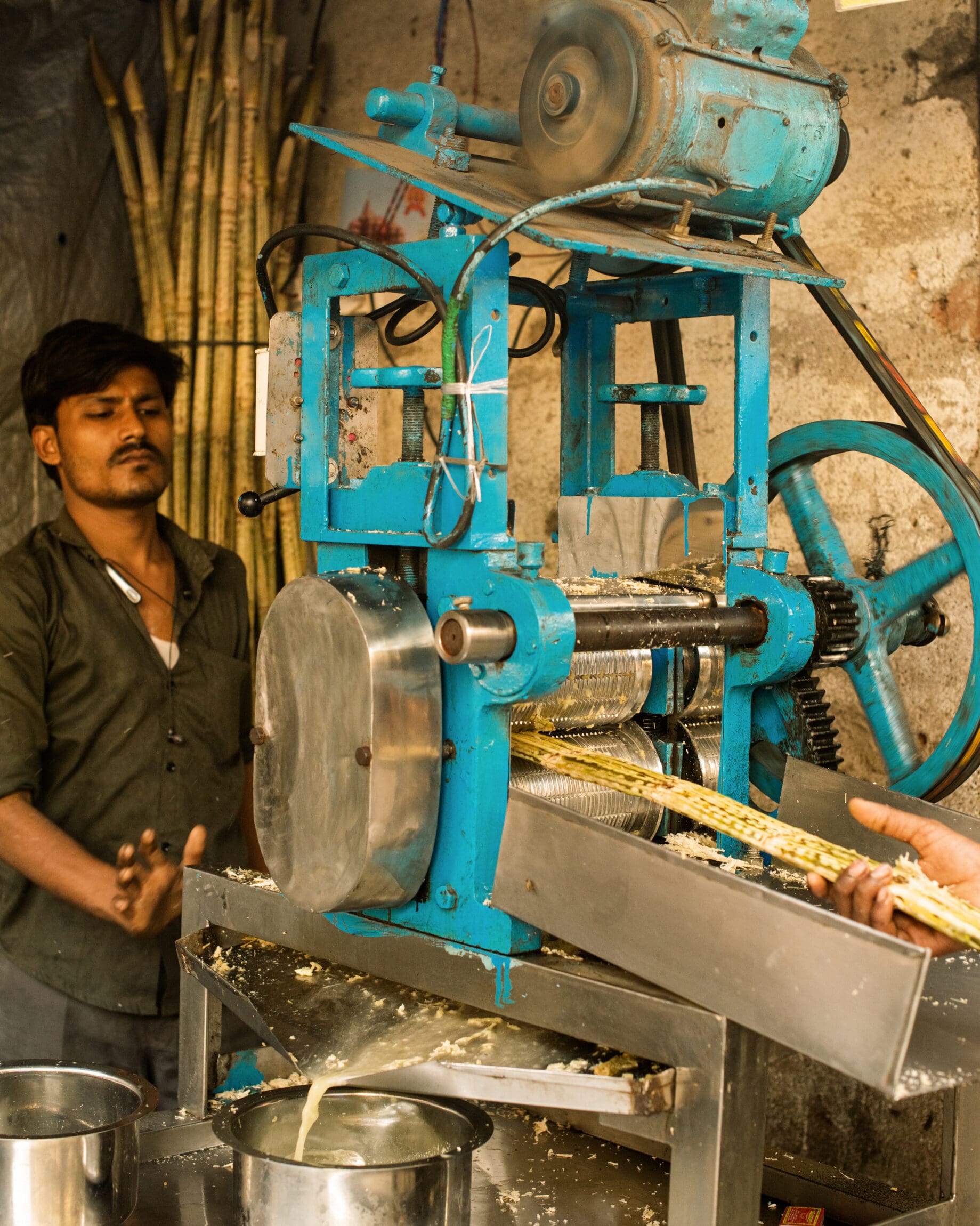 The best street food in Mumbai | Sugarcane juice being pressed fresh outside Vile Parle station