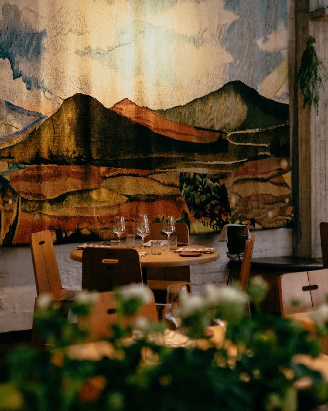 A tapestry on a wall at Maximo Bistrot