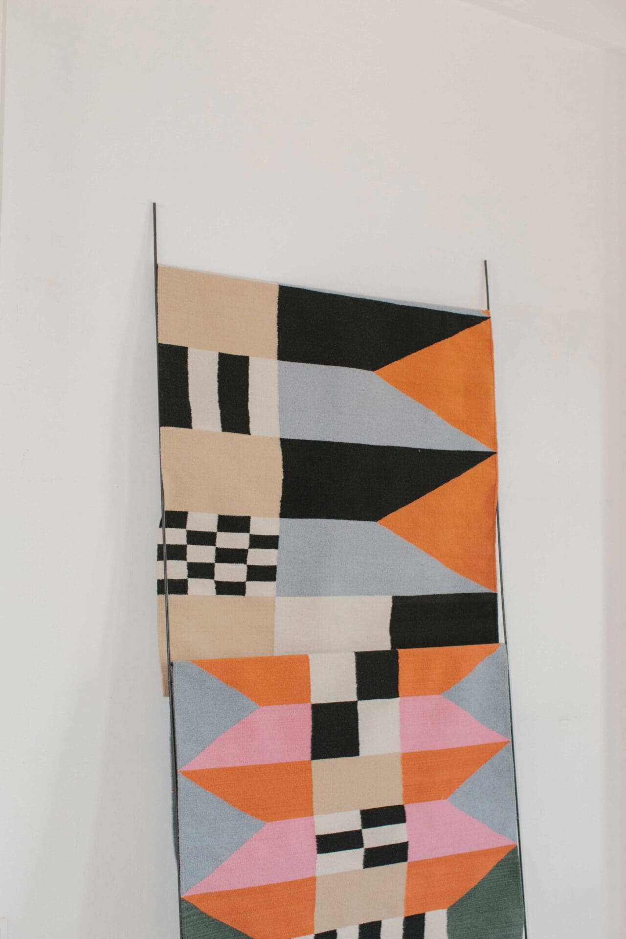 A graphically patterned rug or hanging leans against the way in Javier Reyes's rrres studio