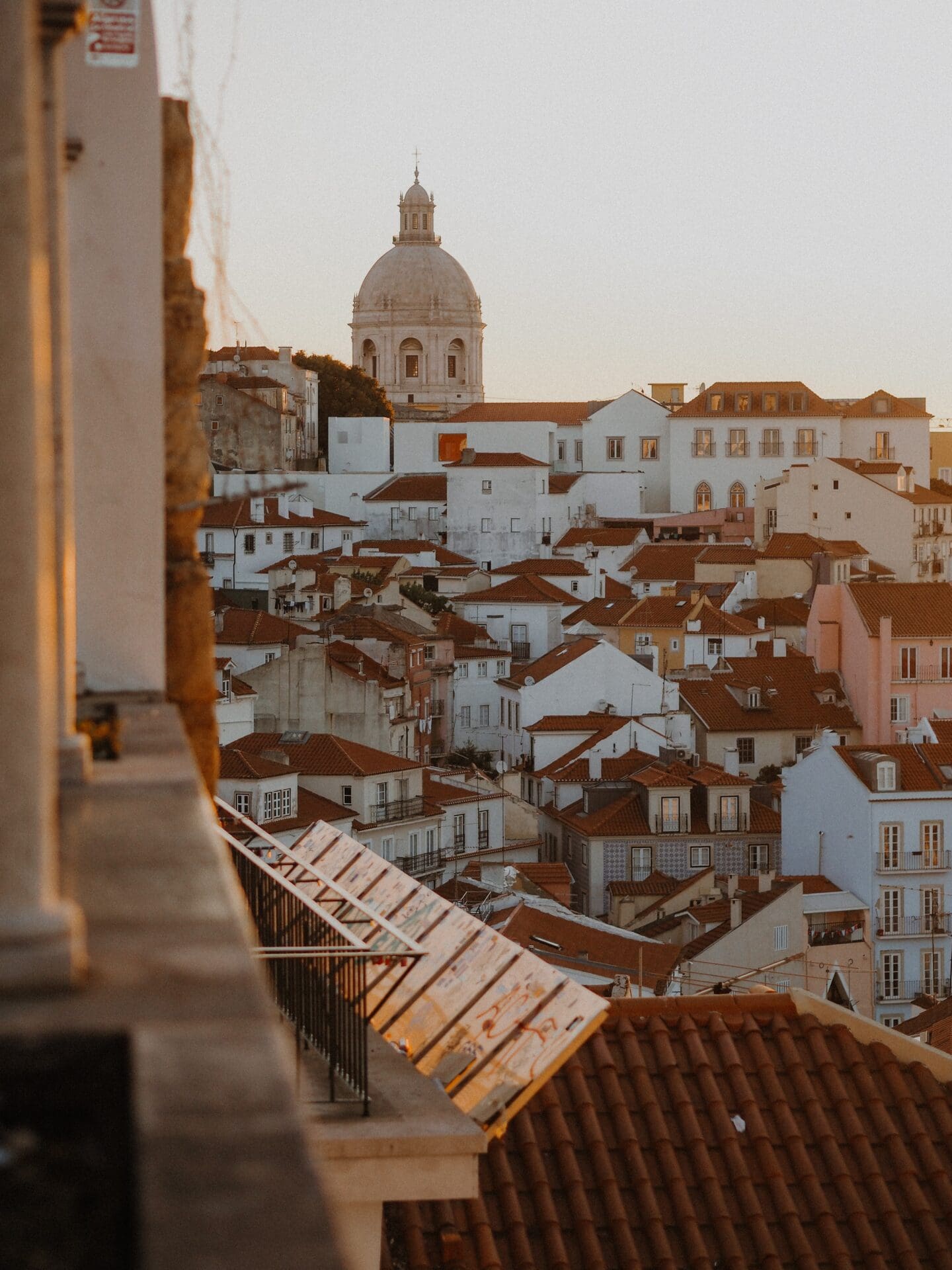 The best European cities for remote working | A view of the terracotta rooftops of Lisbon at sunrise