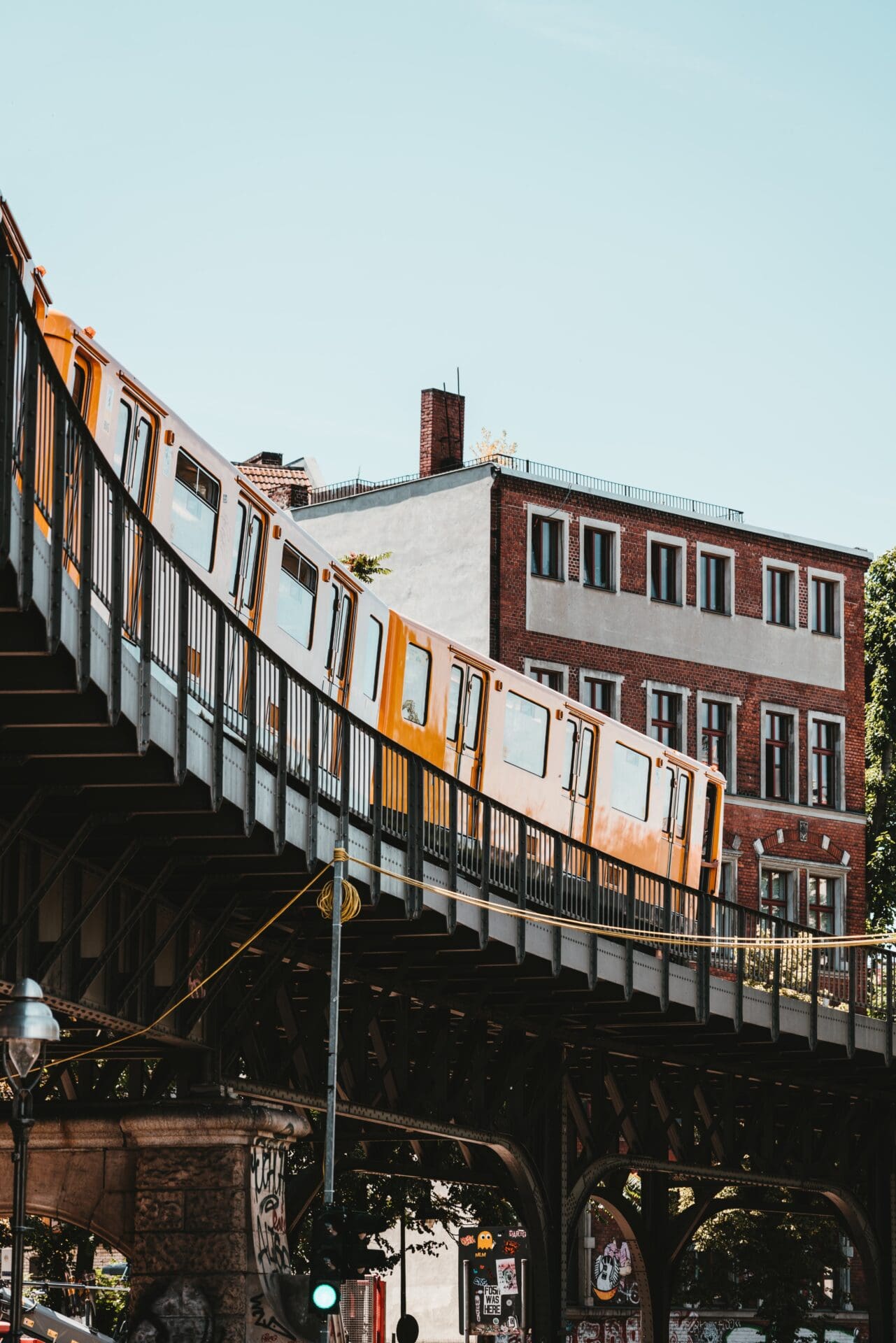 The best European cities for remote working | An U-bahn passing overhead in Berlin, with yellow, square-shaped carriages