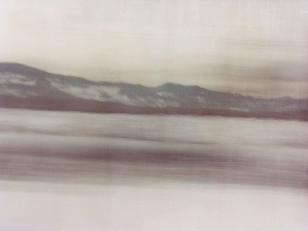 Coco Capitan, Transsiberian | A snowy landscape blurs past a train window