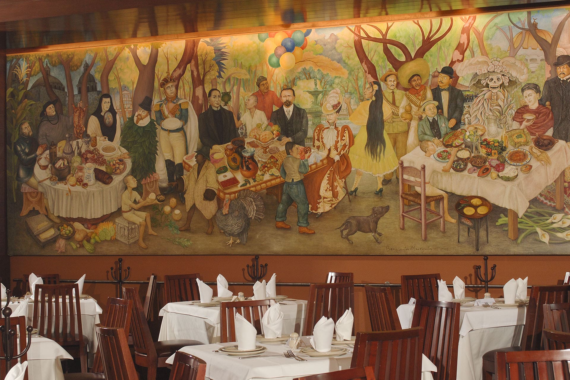 A figurative mural on a wall at El Cardenal in Mexico City