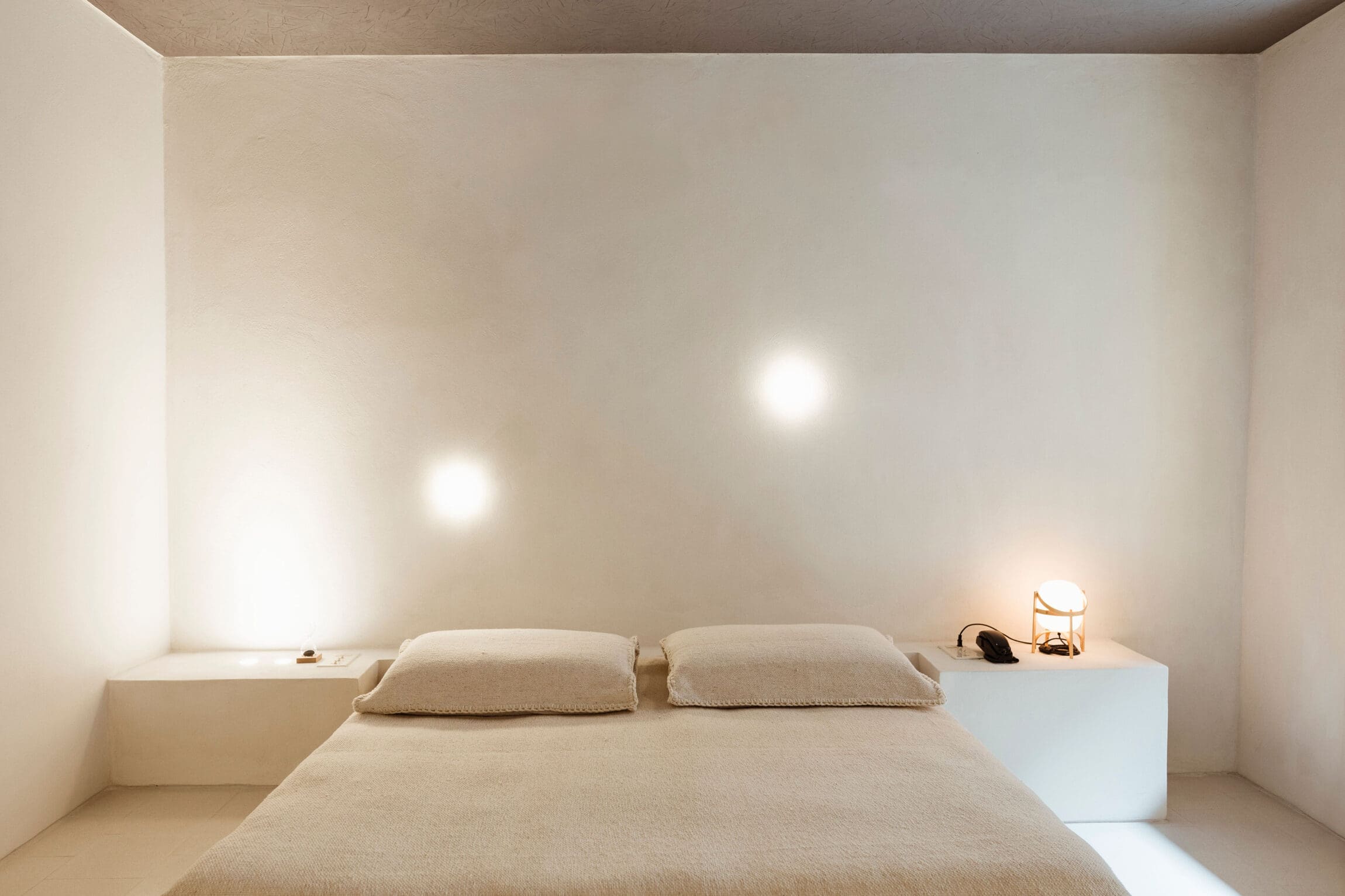 The best boutique hotels in Mexico City | Creme coloured bed in a white room at Circulo Mexicano