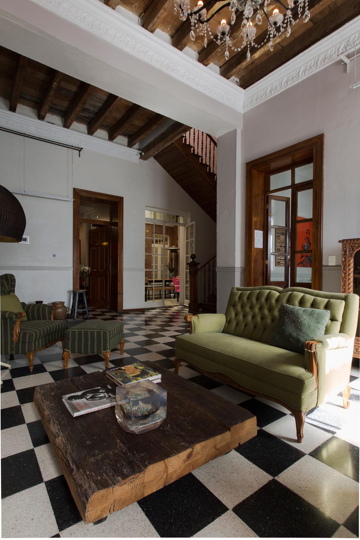 The best boutique hotels in Mexico City | Checkered floors and green couches in El Patio 77