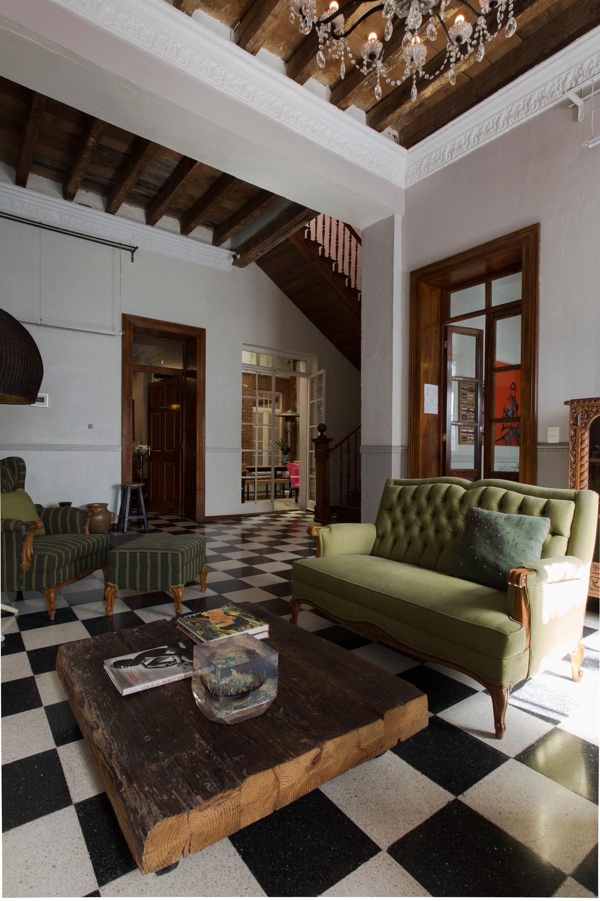 The best boutique hotels in Mexico City | Checkered floors and green couches in El Patio 77