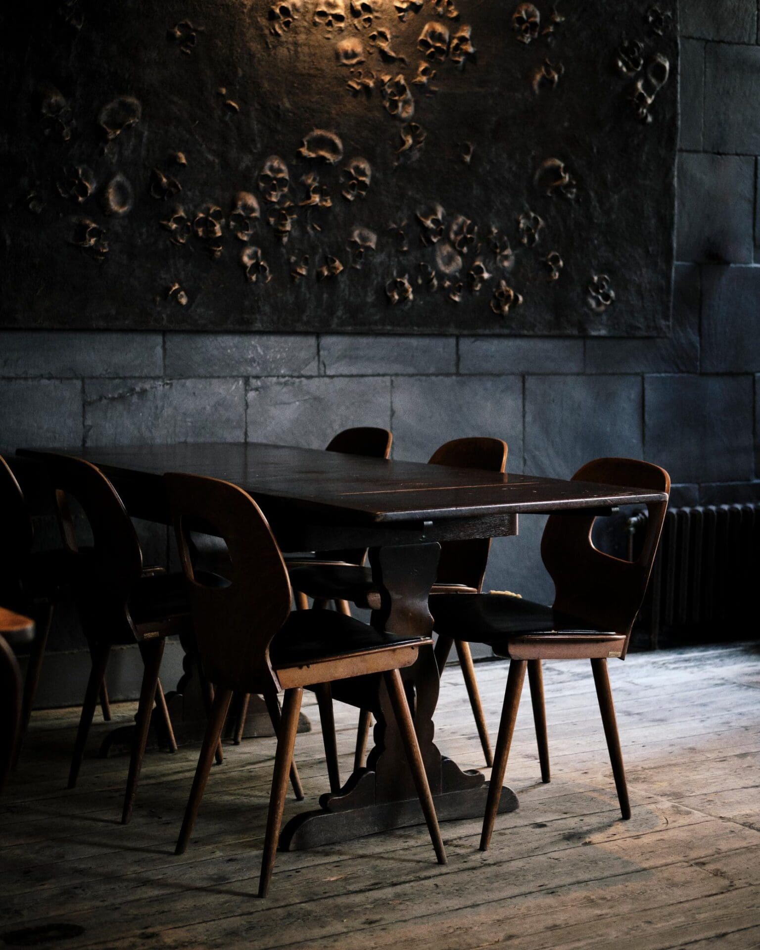 A weekend in Hastings | Tables and chairs inside a dimly lit Dragon Bar in Hastings