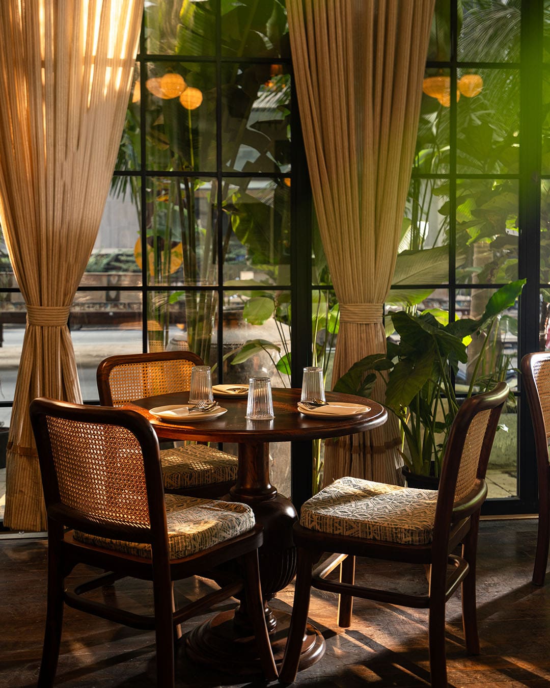 A table by the window at Eve Santacruz in Mumbai