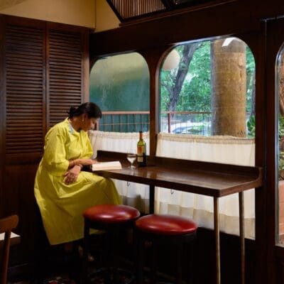 A woman by the window at Kaspers Bombay