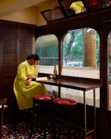A woman by the window at Kaspers Bombay