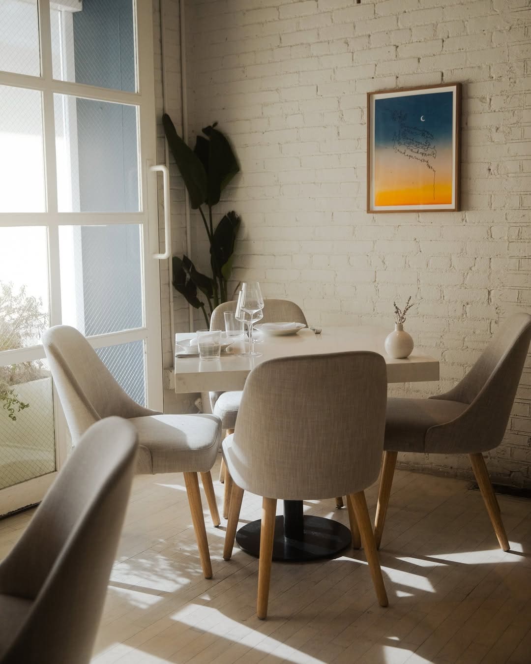 Interiors with whitewashed brick walls at Michelin-starred Camphor, LA