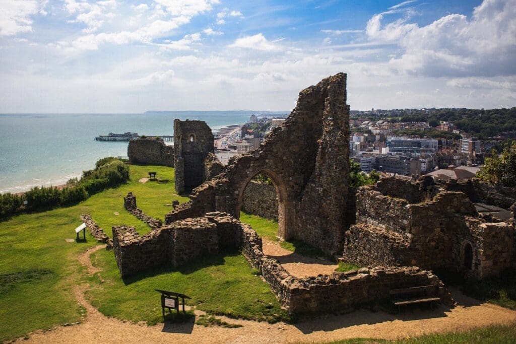 A weekend in Hastings | Hastings Castle, with views of the coast in the distance, and Hastings town behind it